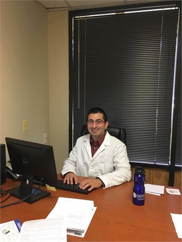 Our dentist Dr. Moumtaz in his office at Aces Dental Flagstaff AZ