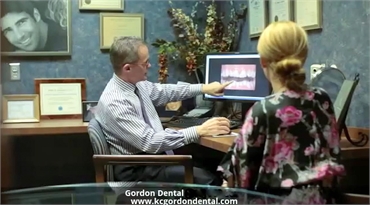 Kansas City dentist Dr. John Gordon explaining orthodontic treatment options to his patient