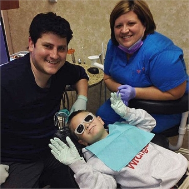 Pediatric dentist Dr. Andrew Simpson of South Shreveport Dental with his patient
