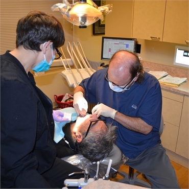 Dr. Hickey performing dental implants procedure at Sound to Mountain Dental Health Center Tacoma WA