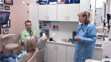 Centennial CO dentist Dr. Bassett explaining dental implant options to patient at Ridgeview Dental