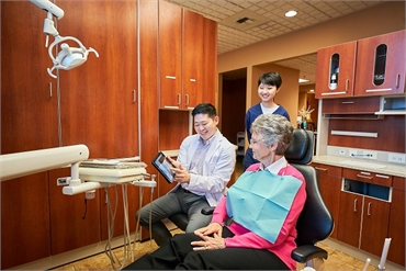 Renton dentist Yuchen Hu DMD working with patient at Hu Smiles in Renton