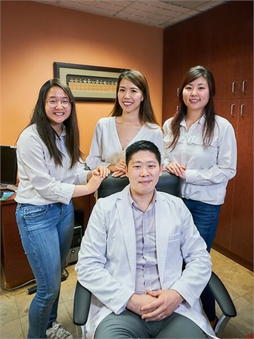 Renton family dentist Hu with his assistants in the office at Hu Smiles