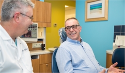 Dr. Bedich explaining dental implant options to patient at The Center for Progressive Dentistry