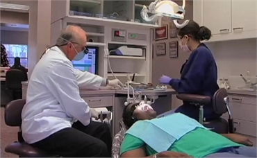 Dr. Reeves performing root canal procedure on patient
