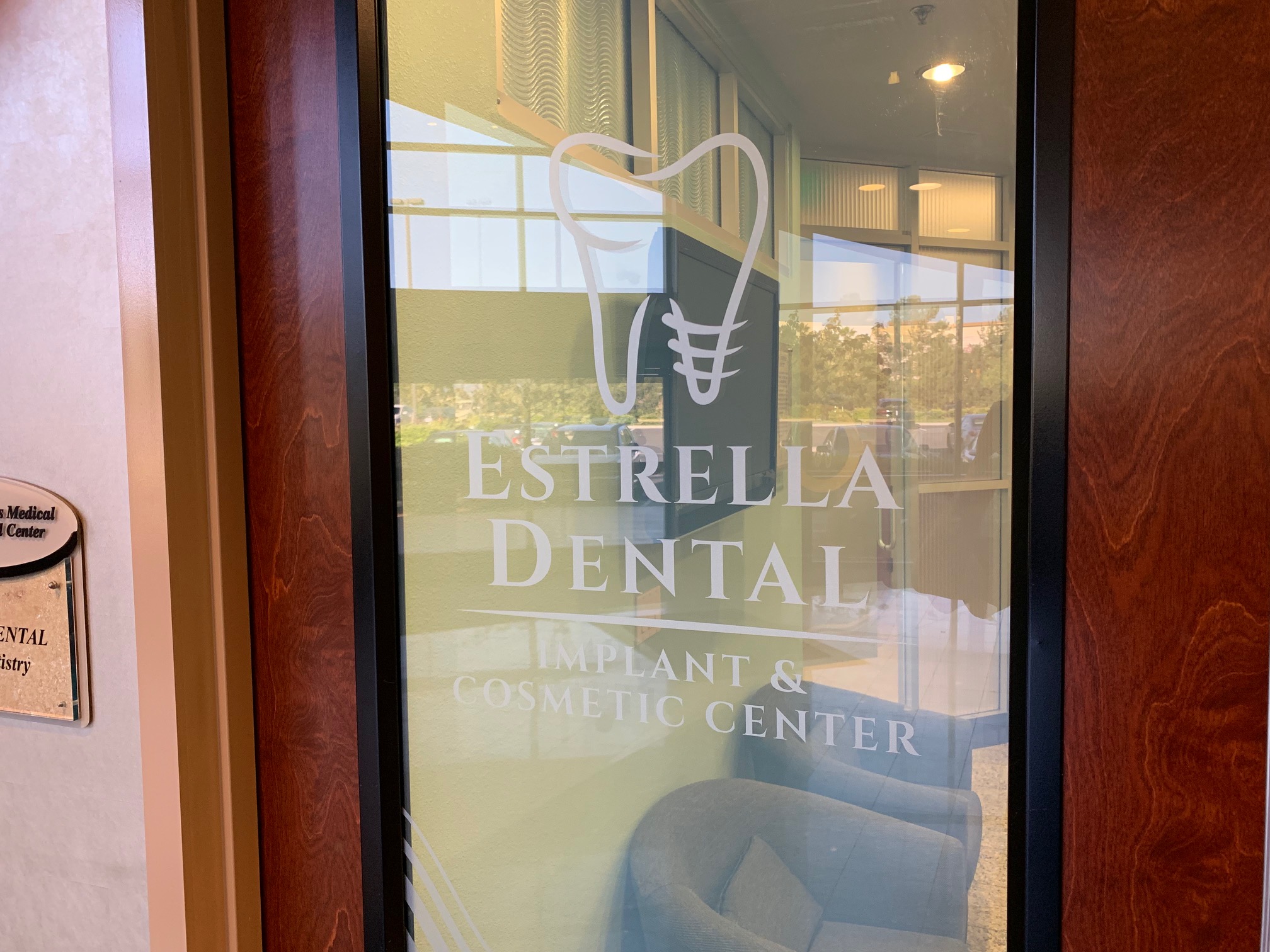 Signage on front door at Chula Vista dentist office Estrella Dental