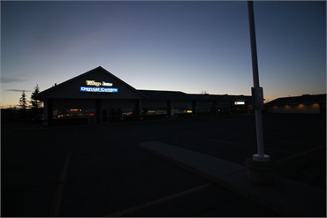 Twilight view of Village Lane Dental Centre Okotoks AB T1S 1Z6