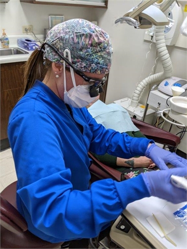 Dental hygienist at work at Harrison Family Dentists