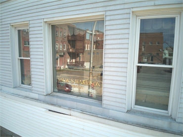 Signage on glass window on Harrison Family Dentists office building