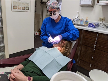 Dental assistant with patient at Harrison Family Dentists