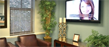 Comfortable waiting room chairs at Burke dentist Burke Centre Dental Arts