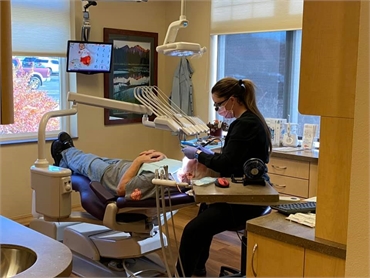Dental hygienist preparing patient for tooth extraction at Luker Dental Greeley CO