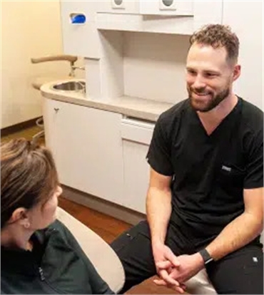Dentist consulting with a patient