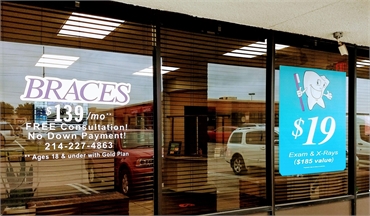 Signage on glass pane at Comfort Dental - Garland