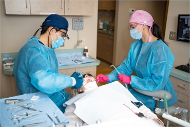 Everett dentist Dr. Yun Kang performing dental implants procedure at 19th Avenue Dental