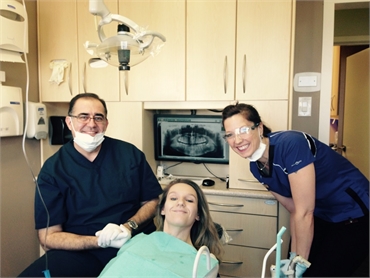 Dr. Wehbe with dental implants patient at Strathcona Dental Clinic