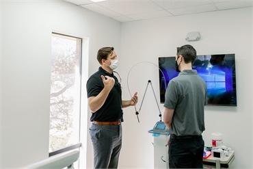 Medicaid Pediatric dentist in Fort Worth Justin Warcup explaining dental procedures