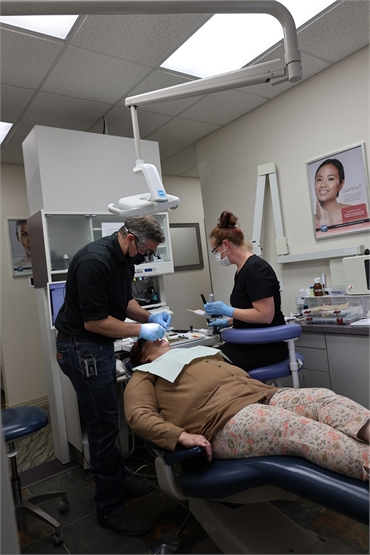 Spokane dentist Dr. David Welton treating an emergency dentist at Serenity Dental