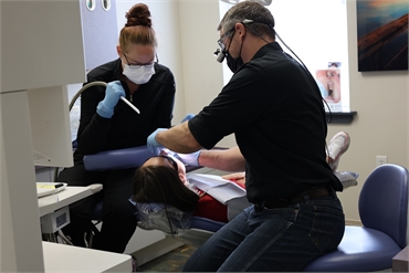 Spokane dentist Dr. David Welton at Serenity Dental working on dental implants patient