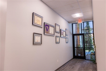 Entrance door and award display wall at Pine Hills Dentistry Grass Valley