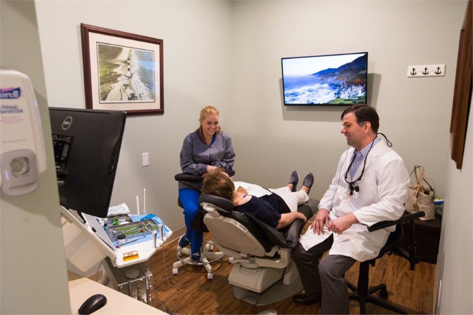 Johns Island dentist Dr. Game explaining dental implants to patient at Stono Dental Care