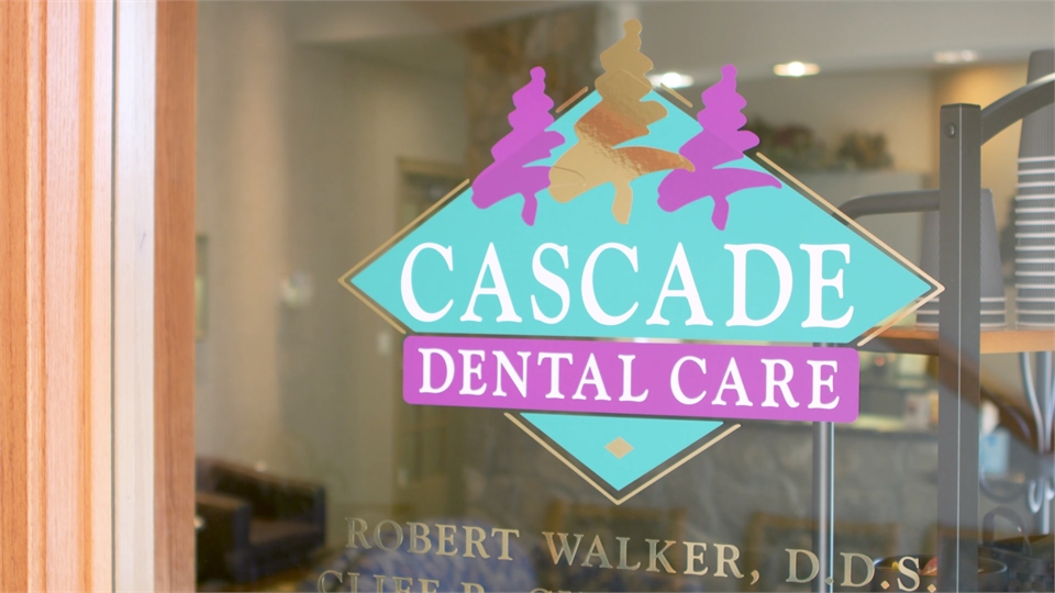 Signage on glass panel at Cascade Dental South Hill