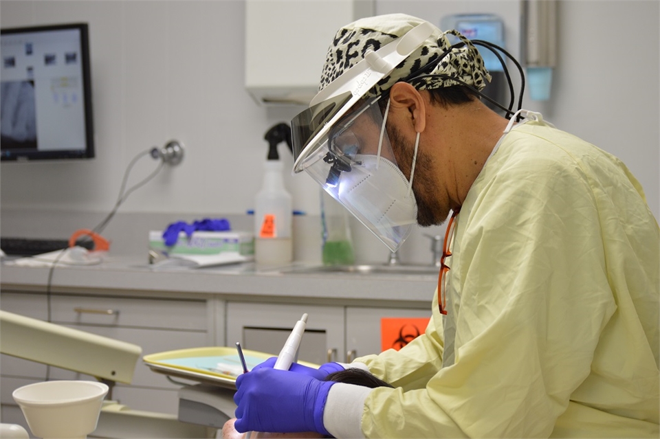 Dental hygienist with dental implants patient at Banker Dental Associates