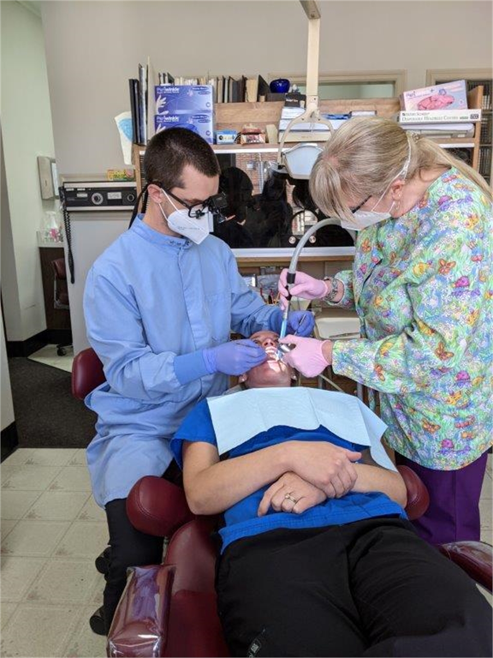 Gloversville dentist Dr. Devin Harrison placing dental crown at Harrison Family Dentists