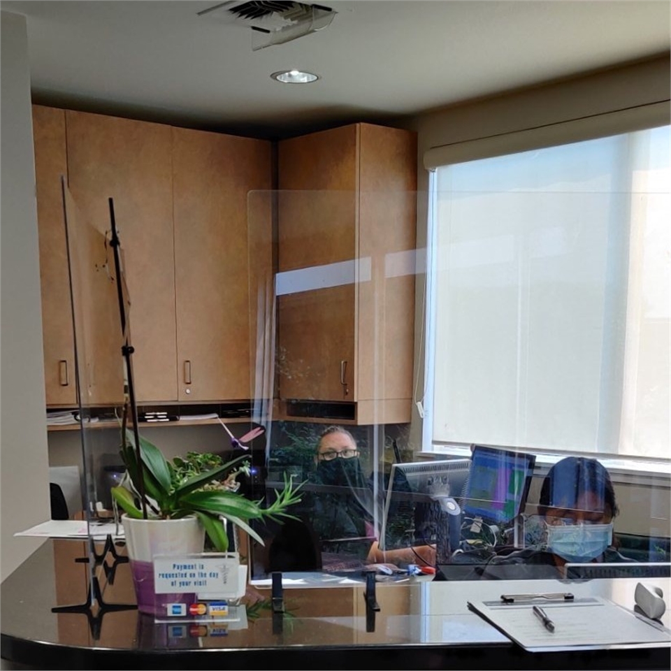 Plexiglass installed at the reception area at Menlo Park dentist Scott