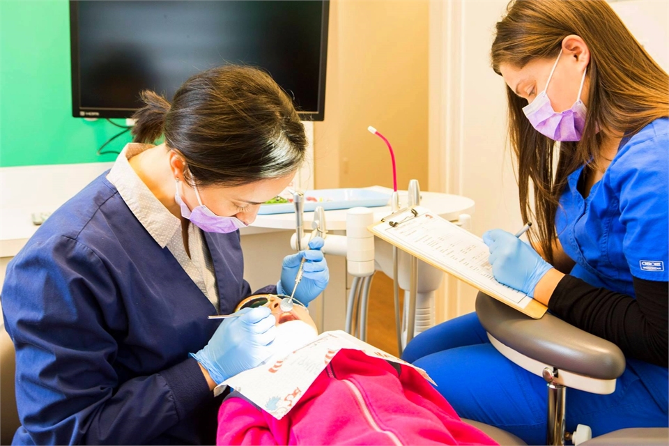 Kid's dentist Dr. Ciano working on one of her patients at Montgomery Pediatric Dentistry