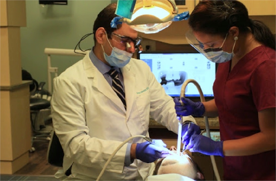 Woodbridge orthodontist Dr. Ahmed Uthman at work at Potomac Family Dental