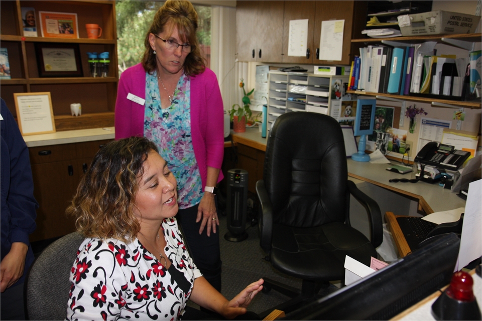 Reception staff planning the day's appointment at Bremerton dentist Current Dental