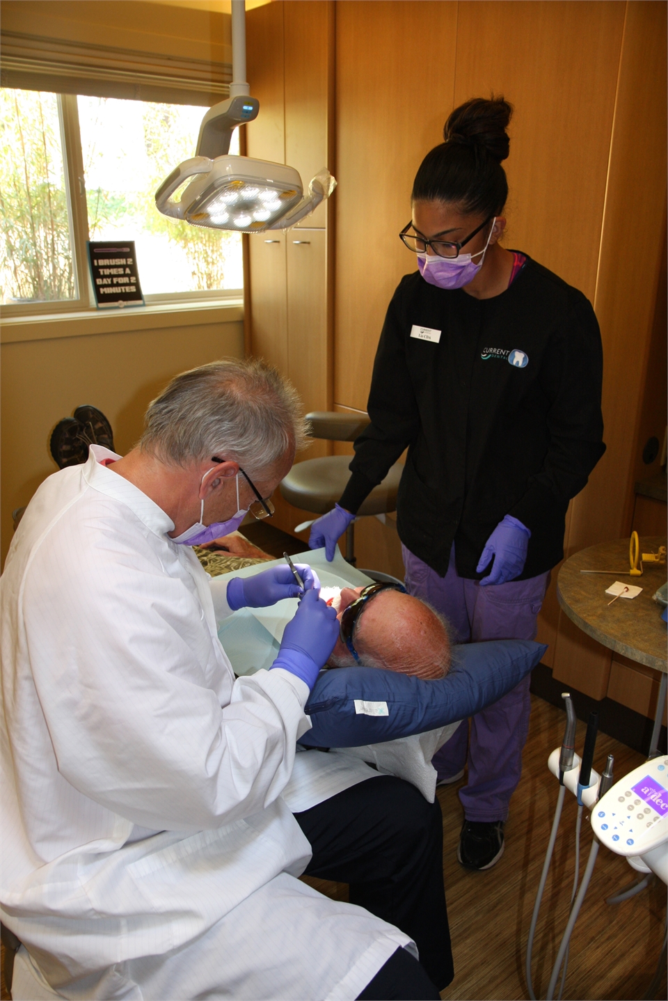 Bainbridge Island dentist Dr. Verharen fixing a dental crown at Current Dental