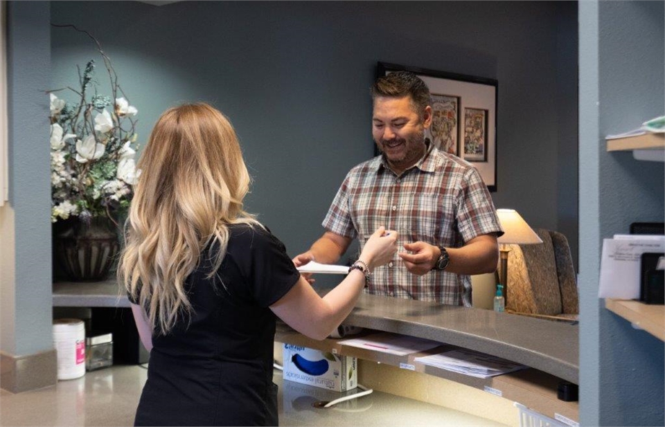 Warm and friendly staff at reception area at Radiant Family Dentistry