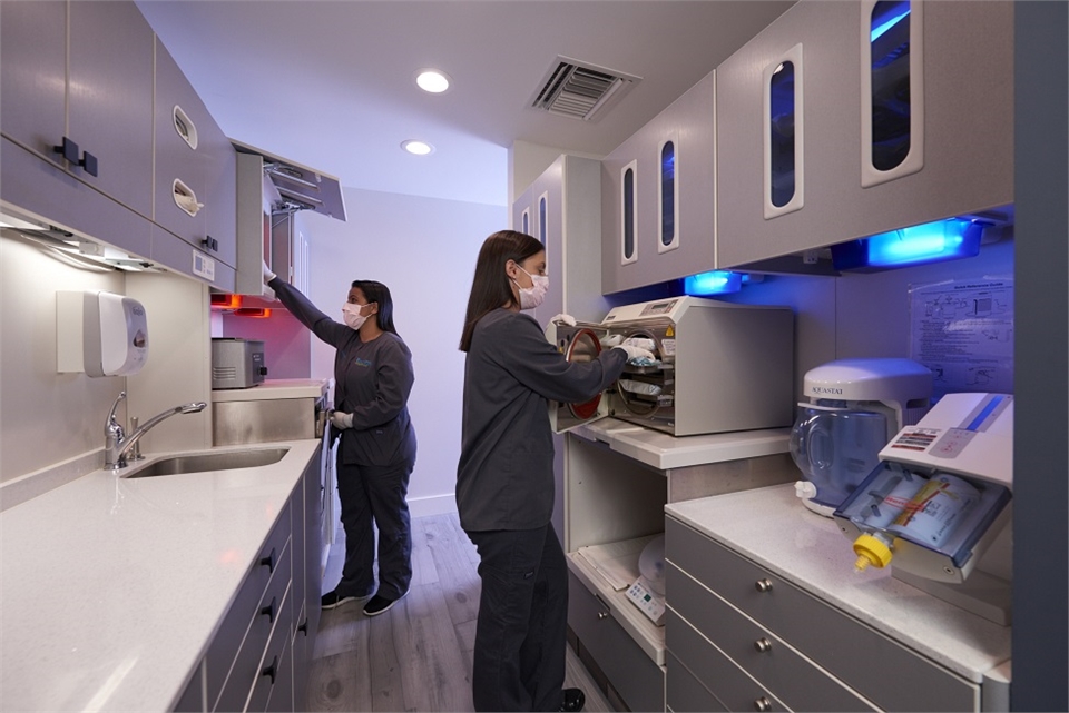 Dental hygienists at work in sterilization room at Coral Springs dentist Dental Wellness Team