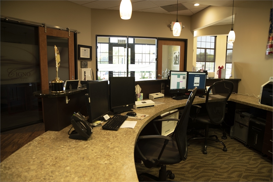 View of entrance door from front desk at Cigno Family Dental