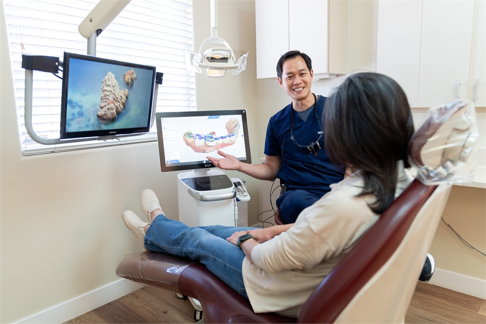 Sunnyvale dentist Derek H. Tang DDS explaining the dental cown procedure to patient