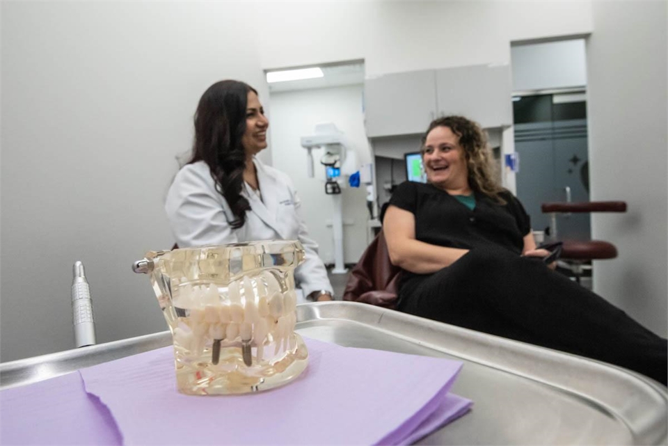 McKinney dentist explaining the dental implants procedure to patient at Starlite Dental