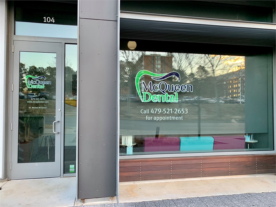 Signage on the storefront at Fayetteville dentist McQueen Dental