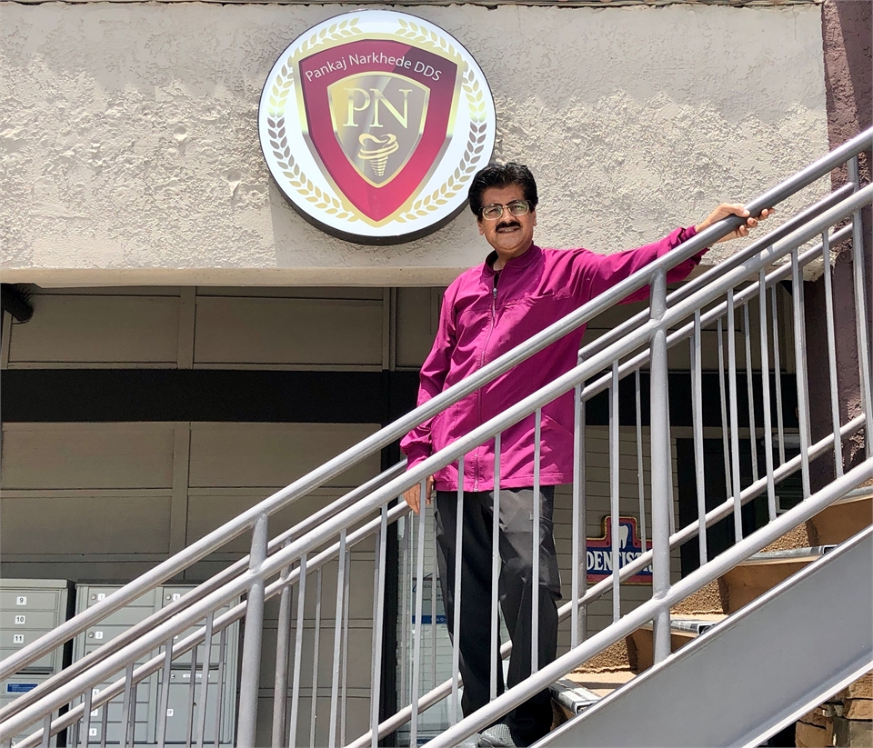 Lake Forest dentist Dr Pankaj Narkhede standing outside his office