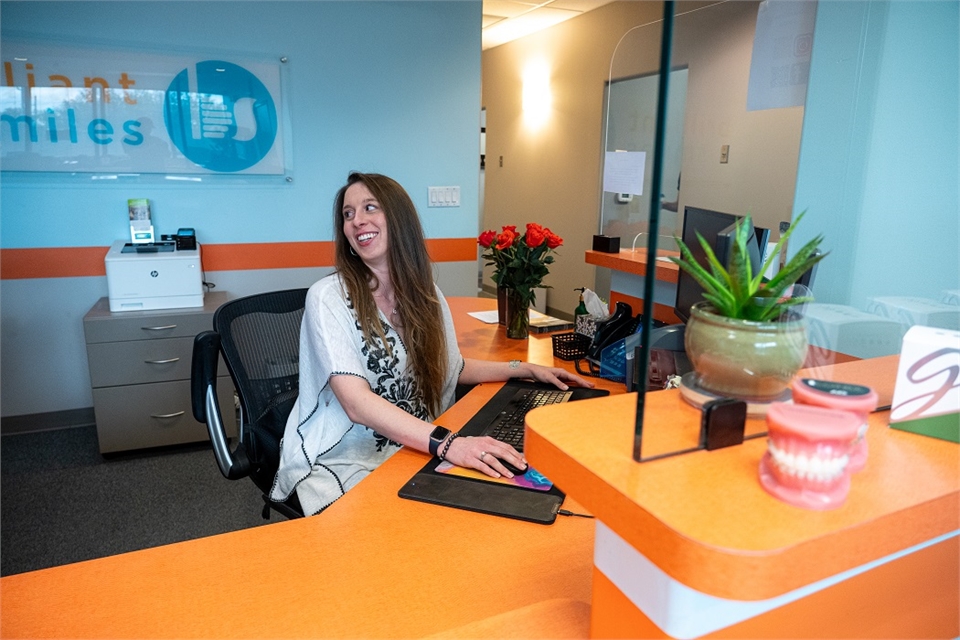 Warm and friendly front desk staff at Austin dentist Brilliant Smiles