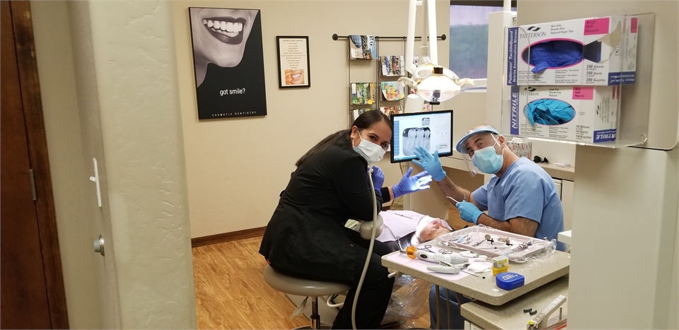 Scottsdale dentist Dr. Samandari performing dental implants procedure at A Reason to Smile