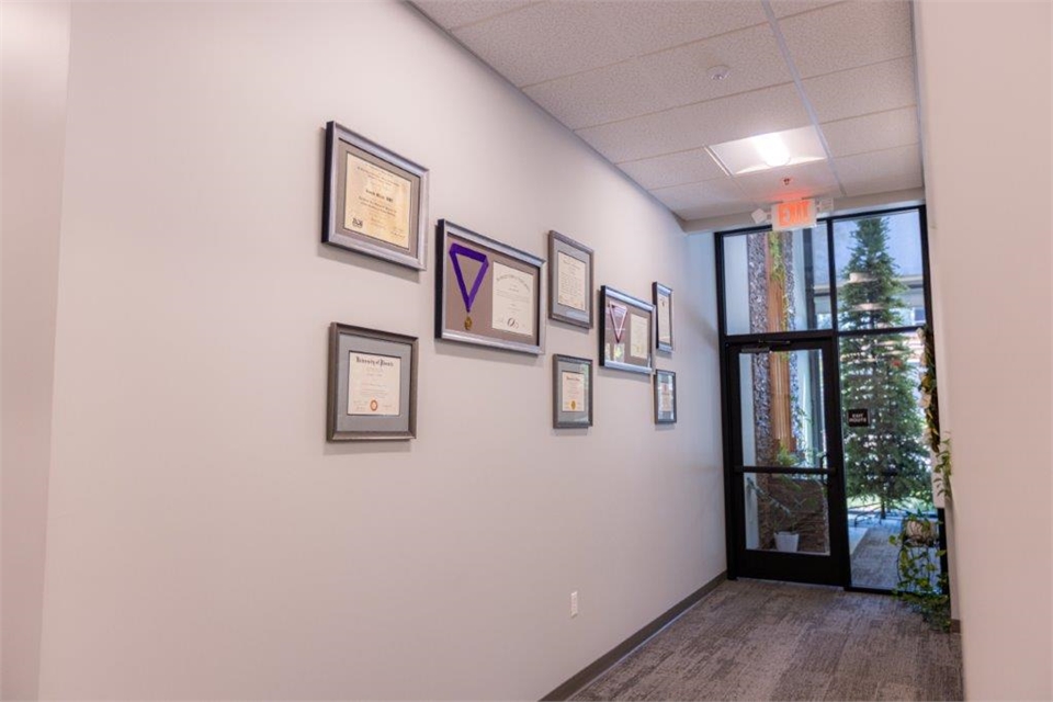 Entrance door and award display wall at Pine Hills Dentistry Grass Valley