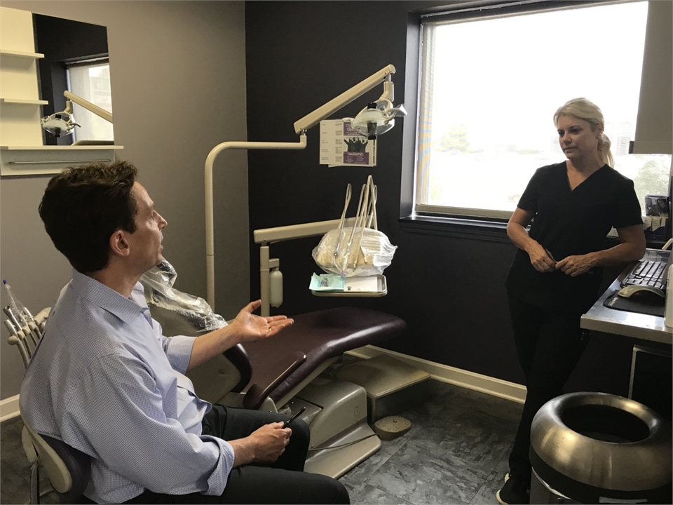 North Canton dentist Dr. Danner discussing case with staff at Danner Dental