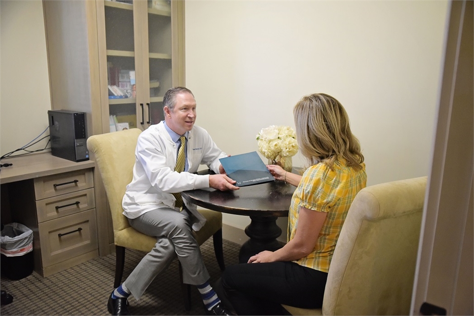 Dr. Warren explains root canal to patient