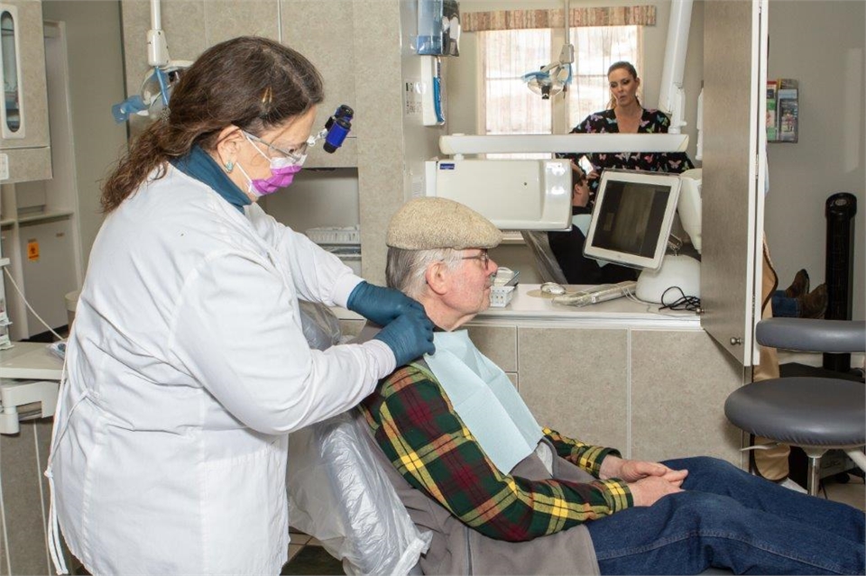 Dr. McMillan with dentures patient at John Day Smiles  