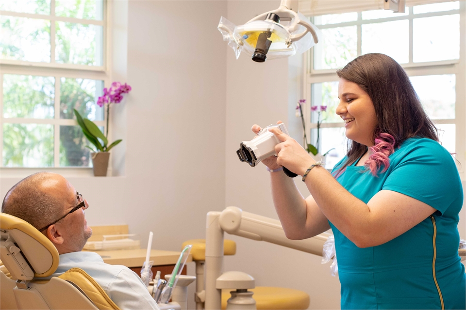 Patient assistant with Shofu Camera at Davie dentist One Dental Studio