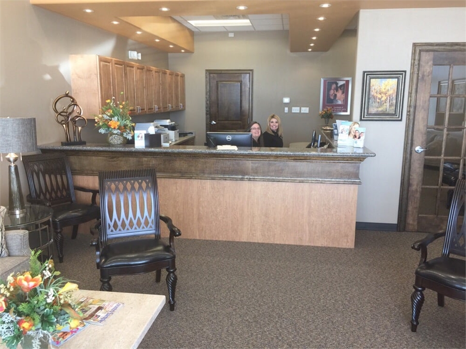 Friendly front desk staff at Sealy Dental Center in Katy