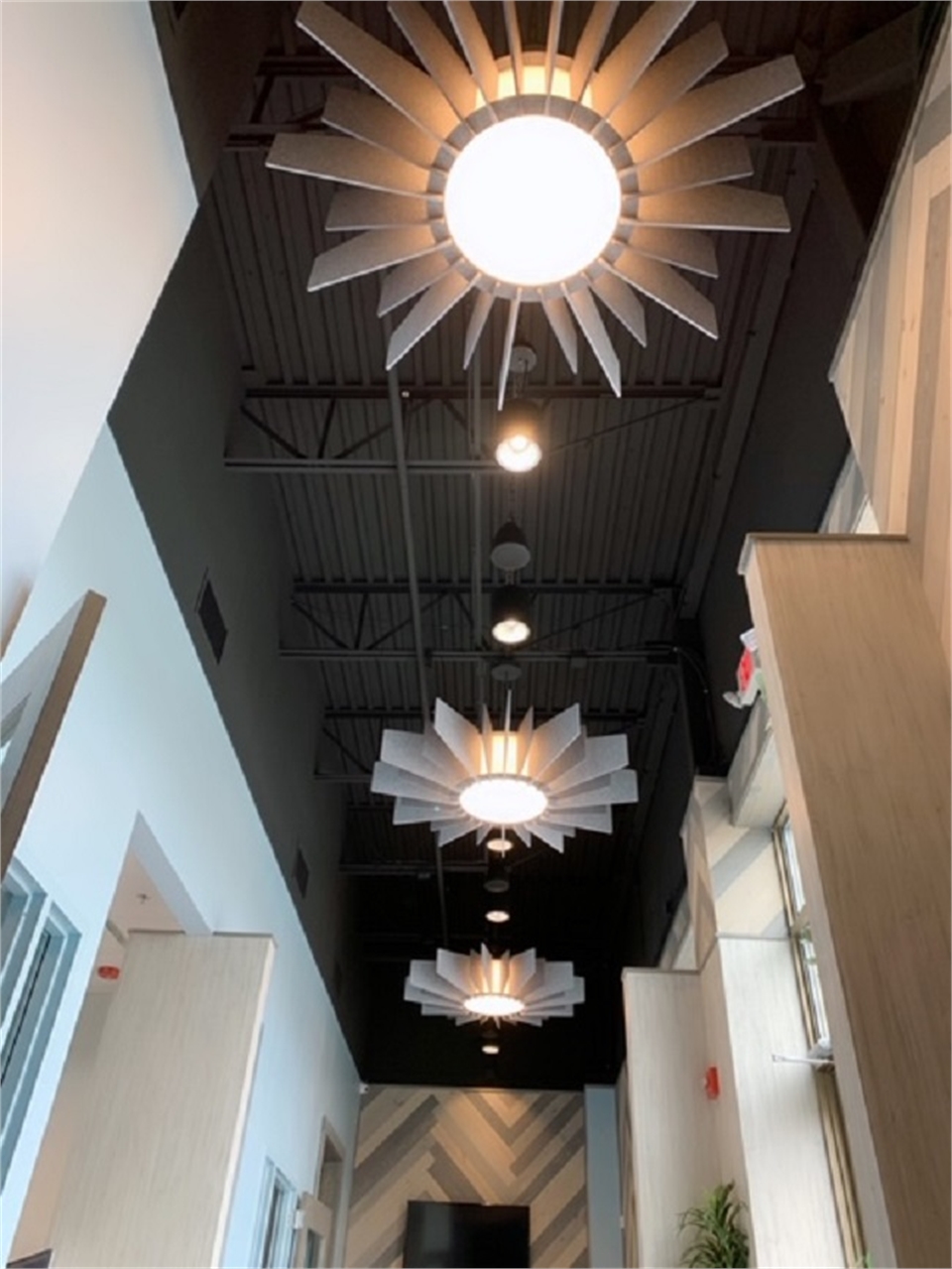 Ornate light fixtures in the hallway at O2 Dental Group of Durham NC