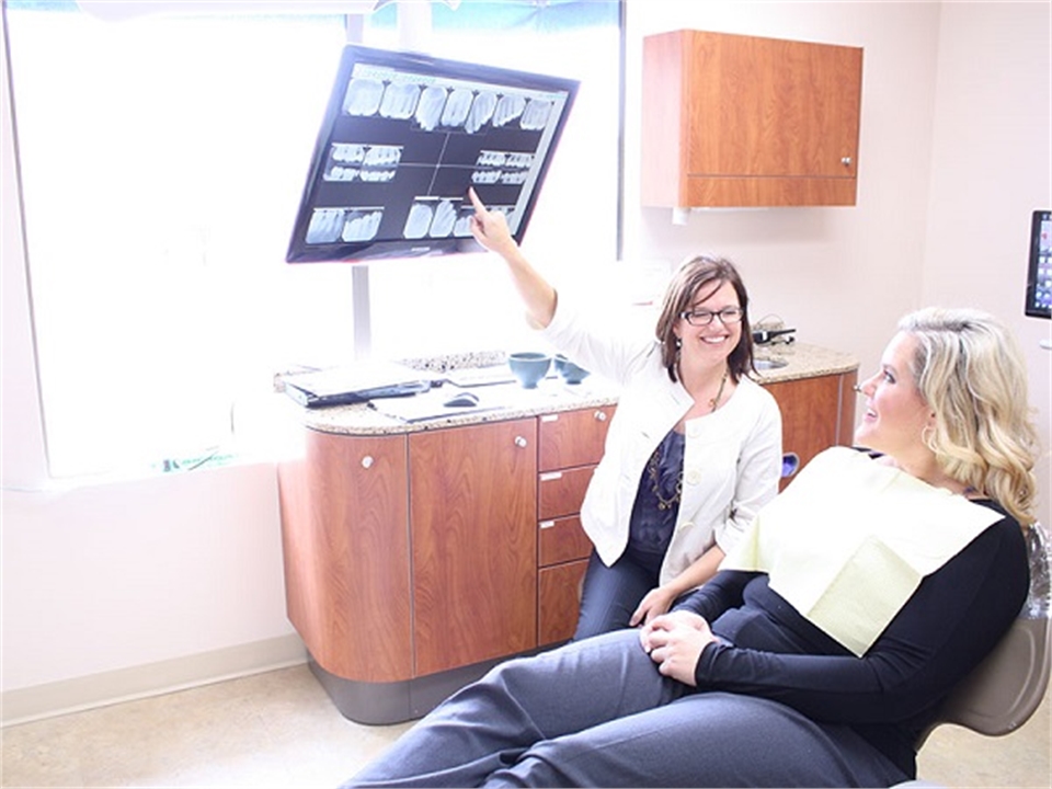 Patient being shown dental xrays at Fidler On The Tooth